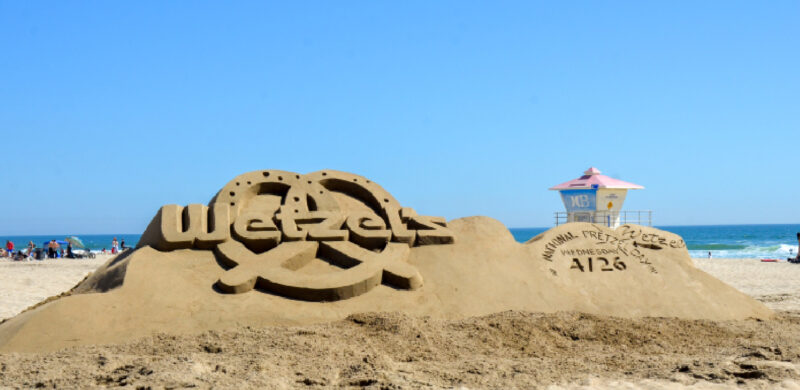 Taking social brand Wetzel's Pretzels to the beach with a giant logo sand sculpture