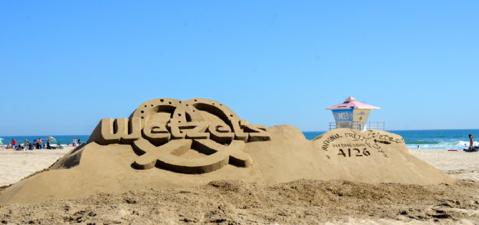 Taking social brand Wetzel's Pretzels to the beach with a giant logo sand sculpture