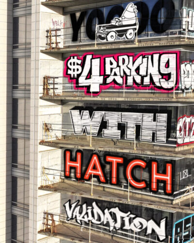 Social media strategy example for Los Angeles restaurant. Image of skyscraper with graffiti saying $4 parking with Hatch validation.