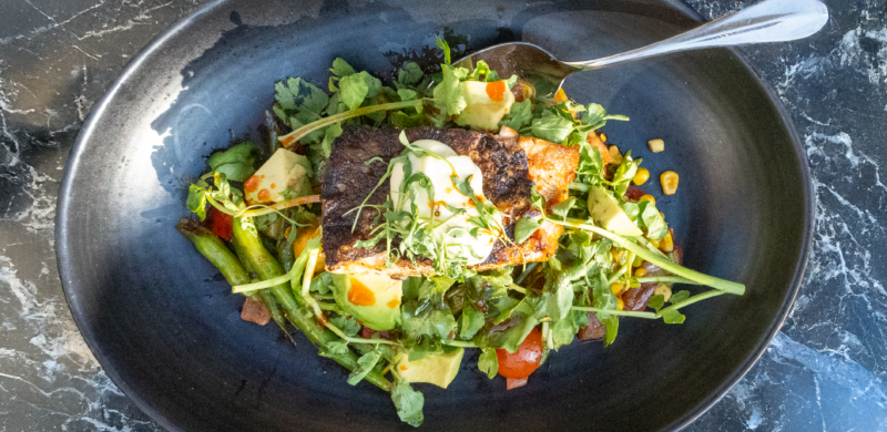 Restaurant Marketing photo of a seafood dish with fresh green garnishes